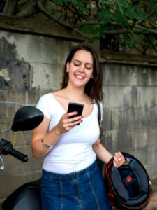 Young modern woman on motorcycle